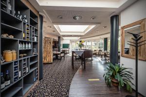 a room with a table and chairs and a dining room at Landgut Stemmen in Stemmen