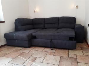A seating area at Appartamento a Dimaro in Val di Sole