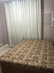 Tempat tidur dalam kamar di Residencial a Beira Mar Pero