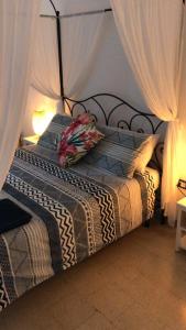 Letto o letti in una camera di Pomelie di Vendicari