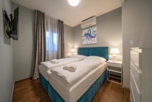 Postel nebo postele na pokoji v ubytování Villa Olivetum