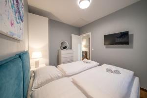 Postel nebo postele na pokoji v ubytování Villa Olivetum