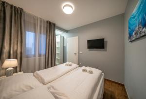 Postel nebo postele na pokoji v ubytování Villa Olivetum
