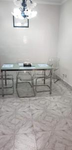 a table and two chairs in a room at Santo Cristo House in Ponta Delgada