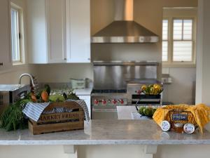 a kitchen with a counter with fruits and vegetables on it at Annie's Place Bed & Breakfast in Boulder Town