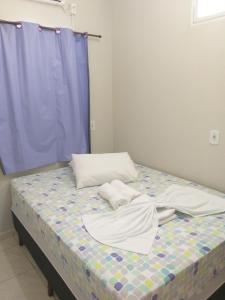 Postel nebo postele na pokoji v ubytování Casa Temporada Suítes