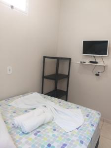 Postel nebo postele na pokoji v ubytování Casa Temporada Suítes