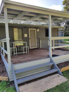 a screened in porch with a pergola at Robe Holiday Park in Robe