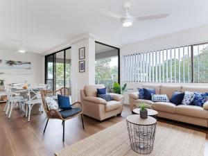 a living room with a couch and chairs and a table at Bangalee 3 Fantastic Waterfront Unit with Pool WI FI and Chromecast in Soldiers Point