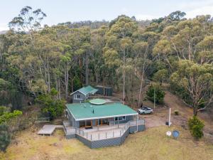 an aerial view of a house in the woods at The Pier House in Lunawanna