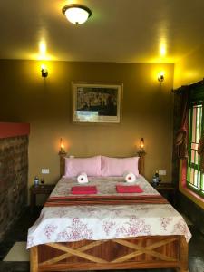A bed or beds in a room at Mondi Lodge Kisoro