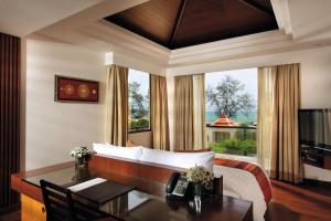 Mövenpick Resort Bangtao Beach Phuket客房内的一张或多张床位