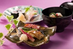 a plate of food on a table with a bowl of food at ANA Crowne Plaza Kanazawa by IHG in Kanazawa