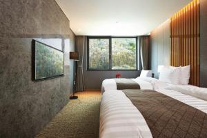 Jeongseon Intoraon Hotel客房内的一张或多张床位