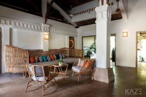 a living room with a couch and chairs and a table at Sailing Club Resort Mui Ne in Mui Ne