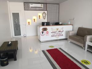 a living room with a couch and a table at Aryaf Nizwa Hotel Apartments in Nizwa