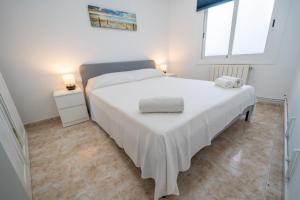 Postel nebo postele na pokoji v ubytování HomeHolidaysRentals Chiara - Costa Brava