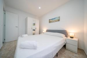 Postel nebo postele na pokoji v ubytování HomeHolidaysRentals Chiara - Costa Brava