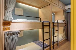 Letto o letti in una camera di 山多香青年民宿 Santhosham Hostel
