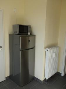 Kuchyň nebo kuchyňský kout v ubytování Schiller Apartments Fabrikantenwohnung