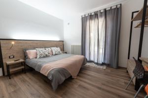 A bed or beds in a room at Le Due Torri