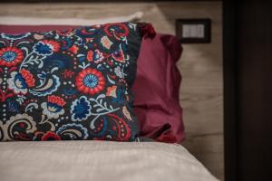 A bed or beds in a room at Le Due Torri