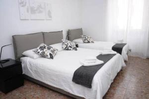 מיטה או מיטות בחדר ב-Al Portico d'Ottavia