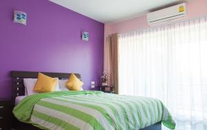 Postel nebo postele na pokoji v ubytování Nam Talay Resort