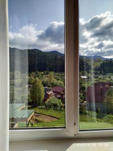 a window with a view of a mountain view at Котедж ,,ТІК" in Tatariv
