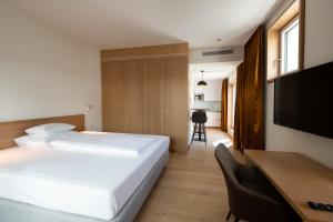 Postel nebo postele na pokoji v ubytování Best Western Hotel Spinnerei Linz