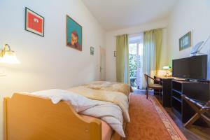 Телевизор и/или развлекательный центр в B&B Sesame Inn