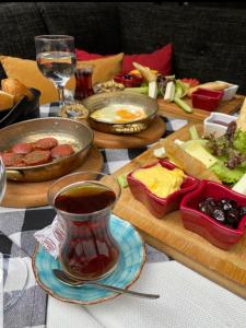 a table topped with food and a cup of tea at Fuego Design Suites in Istanbul