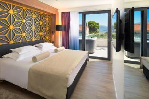 Krevet ili kreveti u jedinici u okviru objekta Amphora Hotel