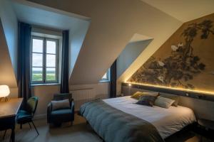 Le Château des Forges客房内的一张或多张床位
