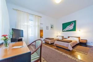 Телевизор и/или развлекательный центр в B&B Sesame Inn +21 фотография