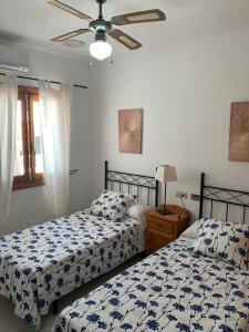 Ein Bett oder Betten in einem Zimmer der Unterkunft Casa el Pez