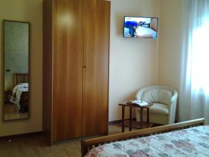 TV a/nebo společenská místnost v ubytování B&B La Palanca