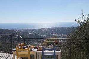 a table with food on it sitting on a balcony at CA' DA TOLLO in Cogorno
