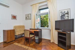 Телевизор и/или развлекательный центр в B&B Sesame Inn