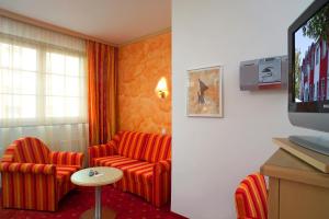 TV a/nebo společenská místnost v ubytování Hotel Restaurant Wallner I contactless check-in