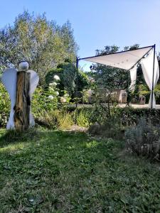 a tent and a pole in the grass at Apartmány Ruprechtov in Hroznětín