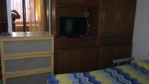 Gallery image of Airport 25 min ByWalk-Big Port 10 min by bus-Bus 1 min by walk to city&beaches-Touristic port at 1 min by walk - WIFI AIR COND WASH MACHINE -4 pex 2 Rooms veranda&GARDEN-FREE PARKING-GIALLO in Olbia