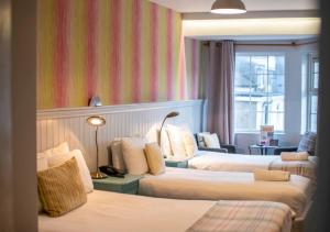 Letto o letti in una camera di Emmet Hotel
