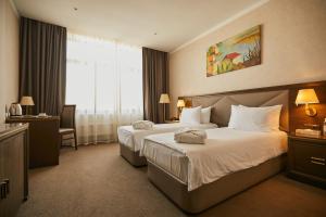 Cama o camas de una habitación en SK Royal Hotel Tula