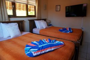 Postel nebo postele na pokoji v ubytování Cariñas Studio Apartments