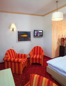 Telewizja i/lub zestaw kina domowego w obiekcie Hotel Restaurant Wallner I contactless check-in