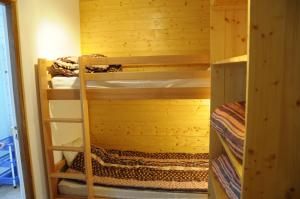 a bunk room with two bunk beds in it at cellier 1 in Les Deux Alpes
