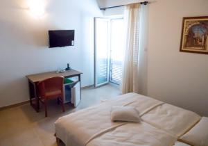 Postel nebo postele na pokoji v ubytování Apartment-rooms Preka