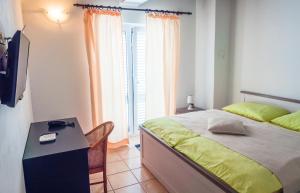 Postel nebo postele na pokoji v ubytování Apartment-rooms Preka