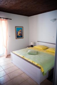 Postel nebo postele na pokoji v ubytování Apartment-rooms Preka